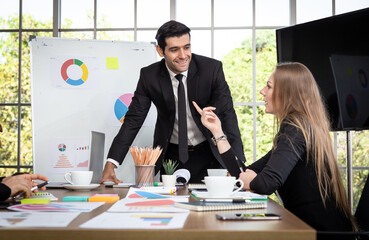 The employees in the company are consulting work with the supervisor to guide.