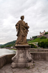 Fototapeta na wymiar Statue of Saint Totnan. Alte Mainbrücke. Würzburg 