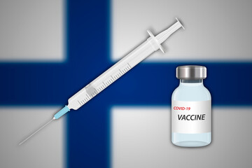 Syringe and vaccine vial on blur background with Finland flag