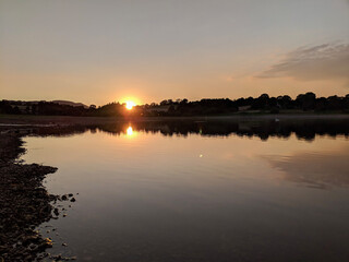 Obraz premium sunset over the river