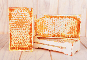 Honeycomb in a wooden frame. Close-up. 