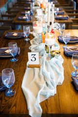 blue wedding cake stands on a blue table
