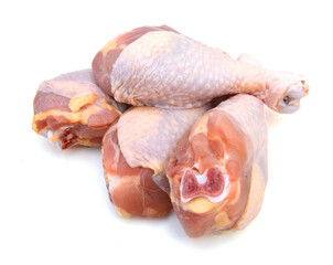 raw chicken legs on a white background