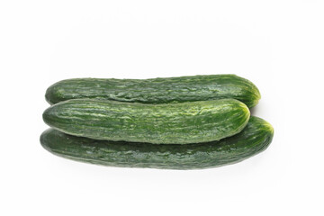 Three fresh cucumbers isolated on white. Fresh vegetables. Top view, copy space, stock photo