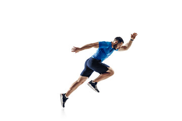 In air. Caucasian professional male athlete, runner training isolated on white studio background....
