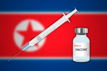 Syringe and vaccine vial on blur background with North Korea flag,