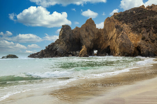 Pfeiffer Beach in Big Sur is an incredibly picturesque beach, beautiful landscape on the Pacific coast, rocks, sand, ocean and sky. Concept, vacation, photo for postcards, tourist and travel guide.