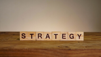 STRATEGY wording on wooden table