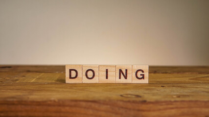 DOING wording on wooden table