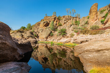 Lake Bear Gulch and rock formations in Pinnacles National Park in California, the ruined remains of an extinct volcano on the San Andreas Fault. Beautiful landscapes, cozy hiking trails for tourists