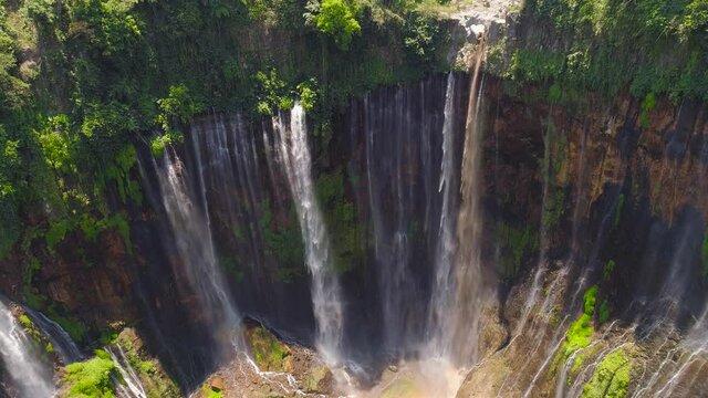 aerial view waterfall coban sewu in Java, indonesia. waterfall in tropical forest by drone Tumpak Sewu aerial footage