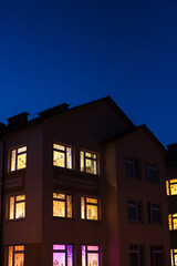 Fototapeta premium light in the windows, house at night, night city 