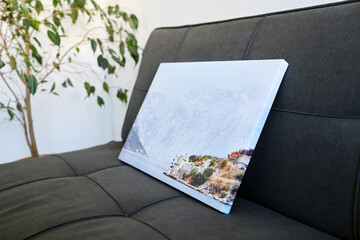 Canvas print stretched on frame with gallery wrap, landscape photography on sofa