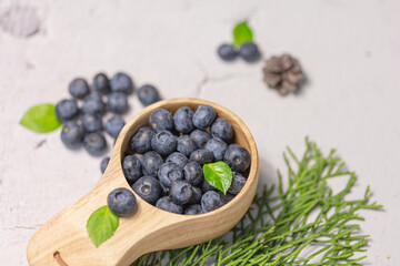 Fresh blueberries in a wooden mug. Natural vitamins concept