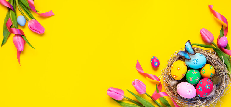 Easter - Colorful Eggs In Nest With Butterfly And Pink Tulips In Yellow Background
