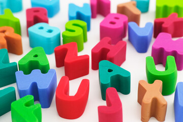 Polymer clay letters scattered on a table