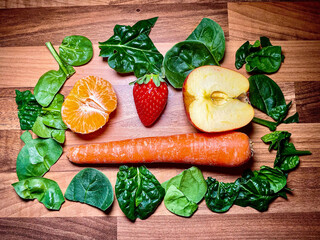  Fruits and vegetables on a wooden chopping board