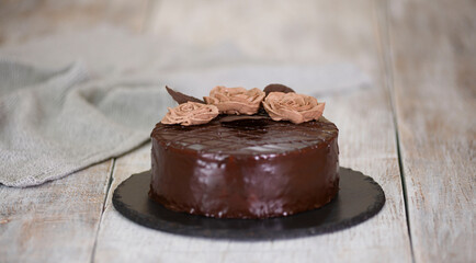 Chocolate cake with chocolate glaze and cream, Prague.