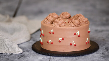 Obraz na płótnie Canvas Chocolate Cherry Layer Cake with Whipped Cream.