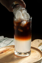 Fresh blending coffee Arabica with sweet coconut juice for health care drinking in home. drinks in summer on dark background copy space.