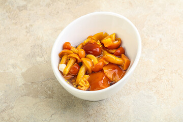 Marinated pickled honey mushrooms in the bowl