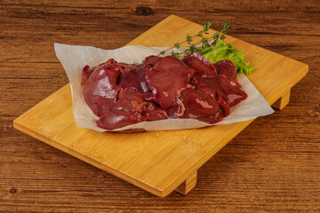 Raw chicken liver over board