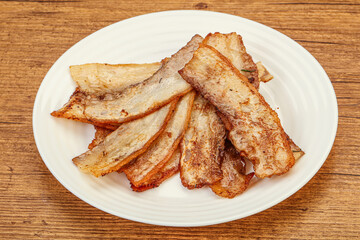 Roasted juicy bacon in the plate