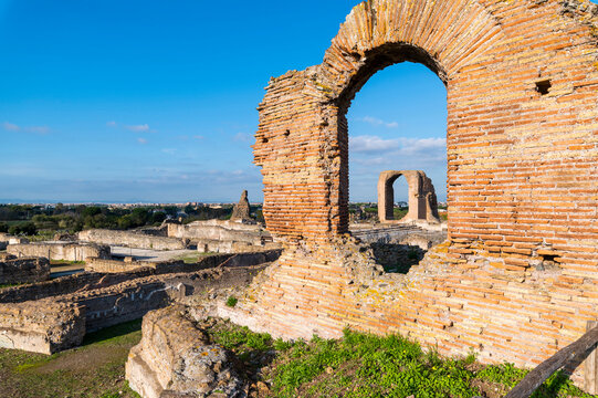 A great image of the Imperial Villa of the Quintilii, architectural detail of the caldarium, the baths, on a beautiful day of blue sky the ruins stand out in the blue. Rome Appia Antica
