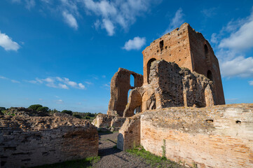 Beautiful architectural perspective of the Imperial Villa of the Quintilii, the caldarium, of the thermal baths, on a beautiful day of blue sky the ruins stand out against the blue. Rome Appia Antica