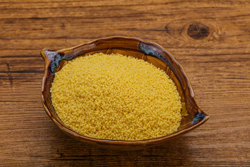 Raw cous cous heap in the bowl