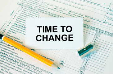 Fototapeta premium Business card with text Time to Change on financial docs