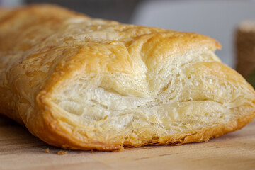 Delicious puff pastry on wooden board
