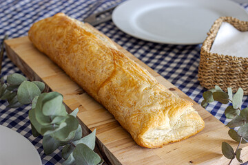 Delicious puff pastry on wooden board