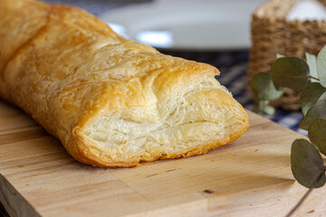 Delicious puff pastry on wooden board