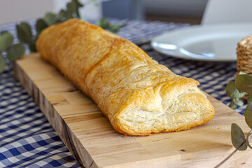 Delicious puff pastry on wooden board
