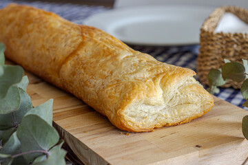Delicious puff pastry on wooden board