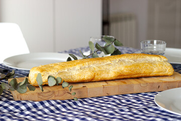 Delicious puff pastry on wooden board