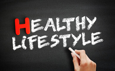 Fototapeta premium Healthy lifestyle text on blackboard, health concept background