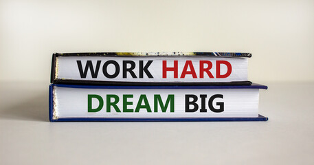 Work hard dream big symbol. Concept words 'Work hard dream big' on books on a beautiful white background. Business, motivational and work hard dream big concept.
