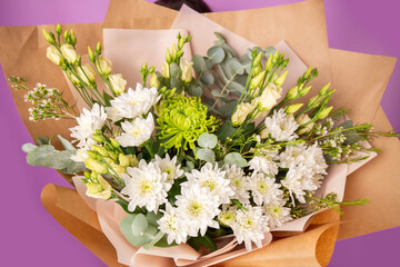 The girl with big bouquet of flowers in front of her