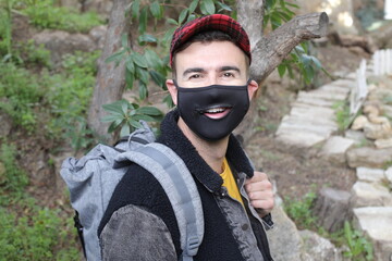 Young man wearing protective mask with open zipper