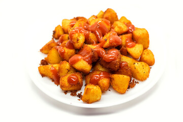 Masala fried Idli or Idli fry - south indian Snack made using with leftover idli served with tomato ketchup. selective focus