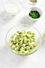 Avocado eggs salad in bowl