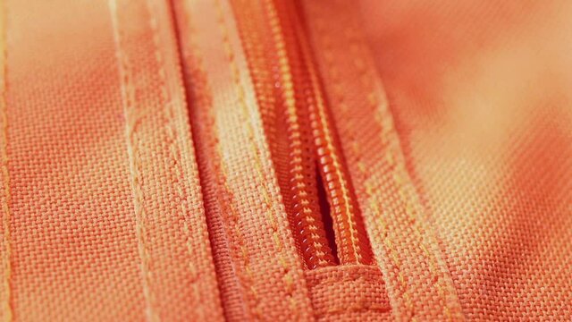 Closing orange zip close up
