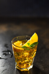 cocktail beverage alcoholic drink transparent glass ice cube lemon mint portion on the table meal outdoor top view copy space for text food background rustic image