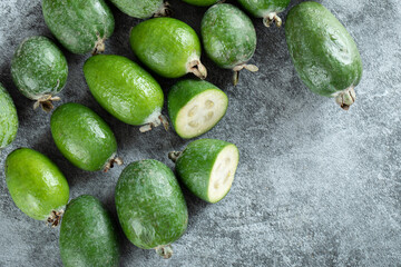 Fresh feijoa fruits on marble wooden background
