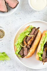 Sandwiches with beef and caramelized onion