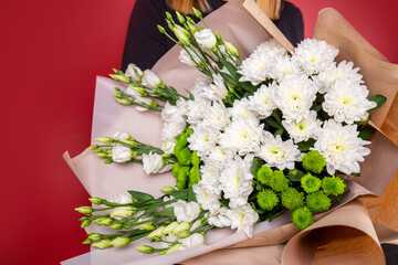 The girl with big bouquet of white flowers