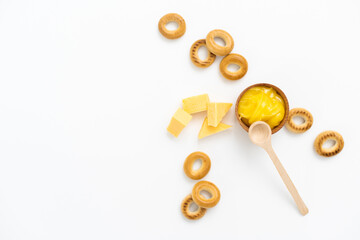 Honey and cheeses on white background