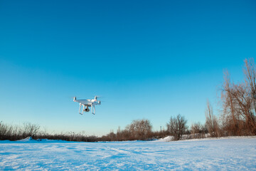 Naklejka na ściany i meble Drone flying in winter 